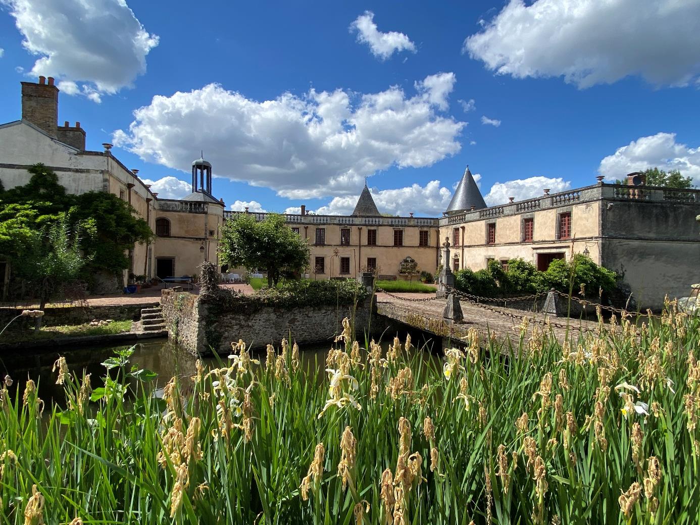 Inner courtyard of Château de Bournizeaux seen across the moat